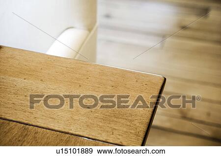 Detail of wood table edge and white chair. View Large Photo Image Stock Photo - Detail of wood table edge and white chair.. Fotosearch