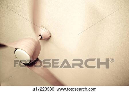 Stock Photograph - Modern Ceiling Fan in Motion. Fotosearch