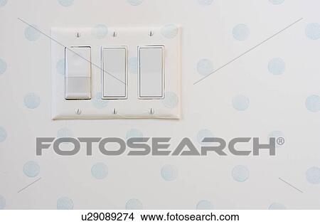 Three light switches on a polka dot wall View Large Photo Image Picture - Three light switches on a polka dot wall. Fotosearch