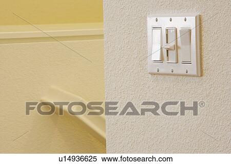 Stock Photography - Three Switch Light Panel on Wall. Fotosearch