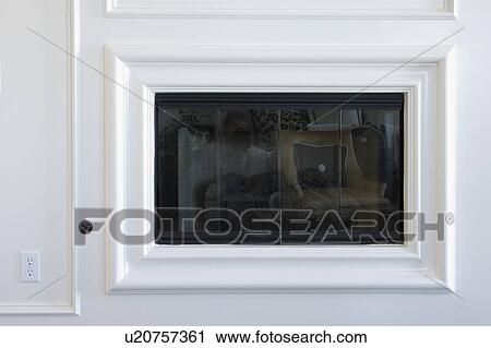 Stock Image - Unlit Gas Fireplace. Fotosearch