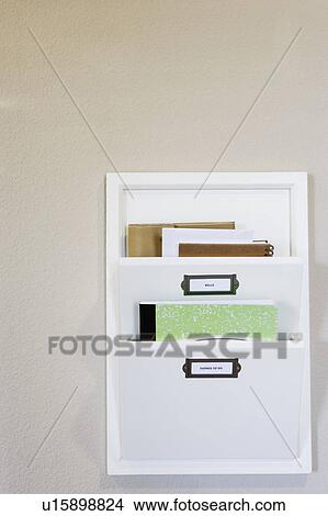 Picture - Wall Mounted File Organizer with Green Notebook. Fotosearch