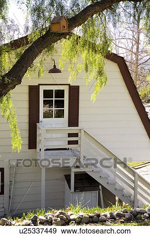 Exterior shot of traditional home with red trim View Large Photo Image Stock Photo - Exterior shot of traditional home with red trim. Fotosearch