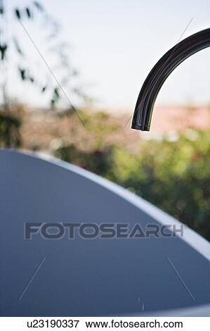Faucet outdoors View Large Photo Image Stock Photo - Faucet outdoors. Fotosearch