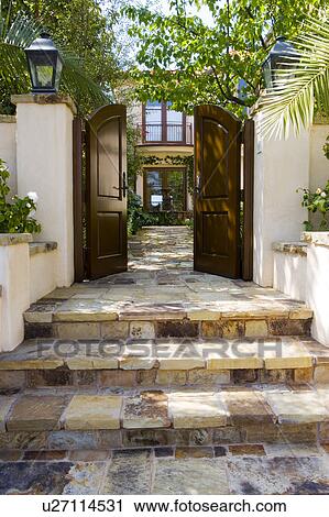 Steps leading to large front gate View Large Photo Image Stock Image - Steps leading to large front gate. Fotosearch