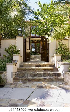 Steps leading to large front gate View Large Photo Image Stock Photo - Steps leading to large front gate. Fotosearch