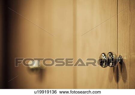 Chrome Knobs on Wood Cupboard View Large Photo Image Stock Photograph - Chrome Knobs on Wood Cupboard. Fotosearch