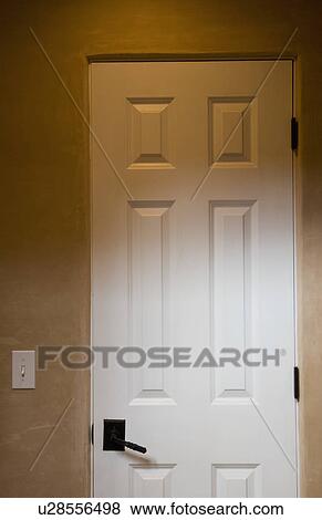 Stock Photo - Detail of a white door. Fotosearch