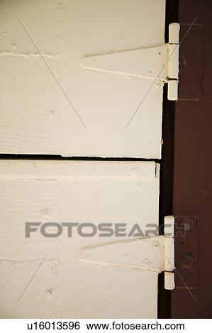 Stock Photograph - Detail of Traditional Red and White Barn Door. Fotosearch