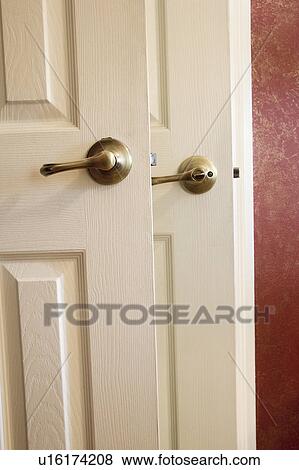 Detail of two door handles and red wall. View Large Photo Image Stock Photo - Detail of two door handles and red wall.. Fotosearch