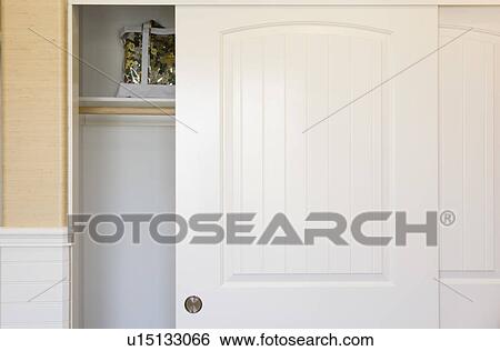 Partially open white closet door View Large Photo Image Stock Photograph - Partially open white closet door. Fotosearch