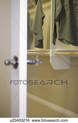 View past cloaset door in to a closet View Large Photo Image Stock Photograph - View past cloaset door in to a closet. Fotosearch