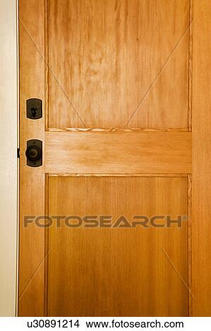 Wood Door with Wrought Iron Knob and Lock View Large Photo Image Picture - Wood Door with Wrought Iron Knob and Lock. Fotosearch