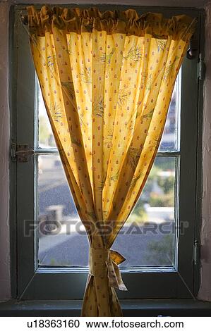 Yellow curtain in front of window View Large Photo Image Stock Image - Yellow curtain in front of window . Fotosearch