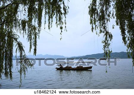 Boat on West Lake in Hangzhou, People's Republic of China View Large Photo Image Picture - Boat on West Lake in Hangzhou, People's Republic of China. Fotosearch