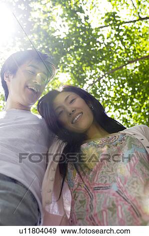 Couple with fresh green View Large Photo Image Stock Photo - Couple with fresh green. Fotosearch