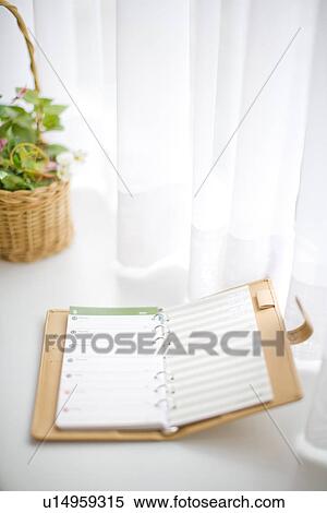 Notebook in the window View Large Photo Image Stock Photography - Notebook in the window. Fotosearch