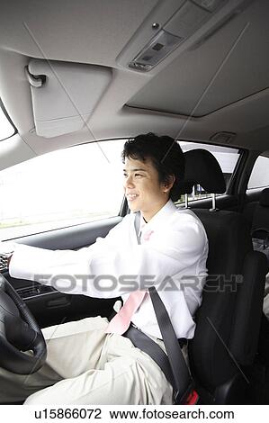Businessman driving a car View Large Photo Image Stock Image - Businessman driving a car. Fotosearch