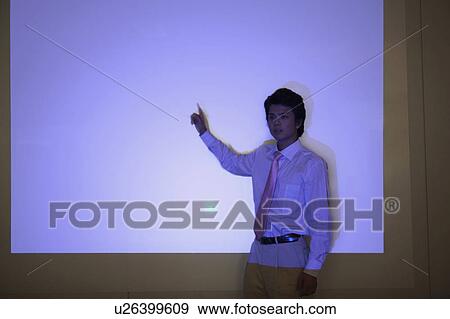 Stock Photo - Businessman giving presentation. Fotosearch