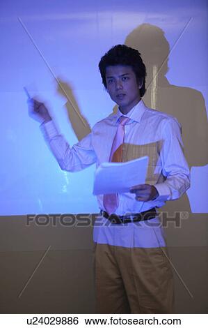 Businessman giving presentation View Large Photo Image Stock Photograph - Businessman giving presentation. Fotosearch