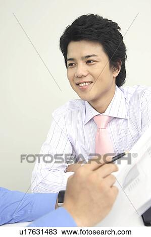 Businessman having a meeting View Large Photo Image Stock Image - Businessman having a meeting. Fotosearch