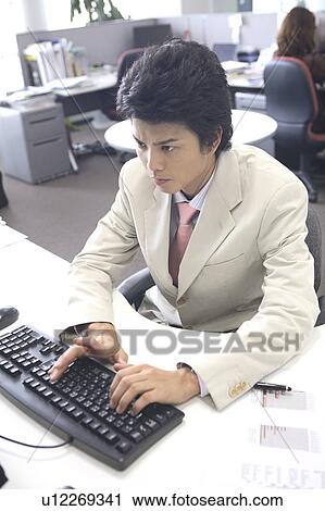 Businessman of hitting keyboard View Large Photo Image Stock Image - Businessman of hitting keyboard. Fotosearch