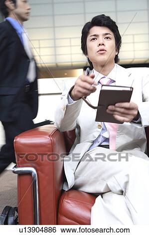 Businessman sitting a chair View Large Photo Image Stock Photograph - Businessman sitting a chair. Fotosearch