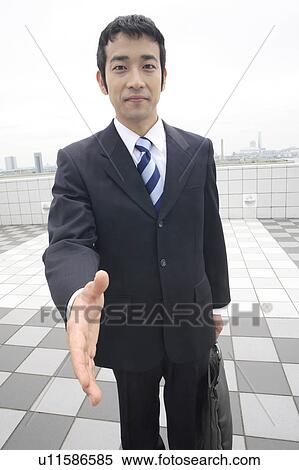 Businessman trying to shake hands View Large Photo Image Stock Photography - Businessman trying to shake hands. Fotosearch