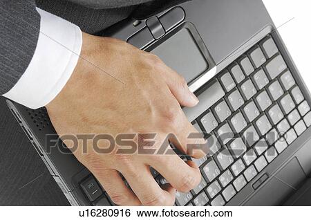 Hand of a man hitting the keyboard of the laptop PC View Large Photo Image Stock Photograph - Hand of a man hitting the keyboard of the laptop PC. Fotosearch