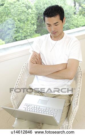 Man who gazes at the monitor View Large Photo Image Stock Photograph - Man who gazes at the monitor. Fotosearch