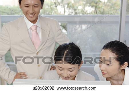 Stock Image - Office scene. Fotosearch