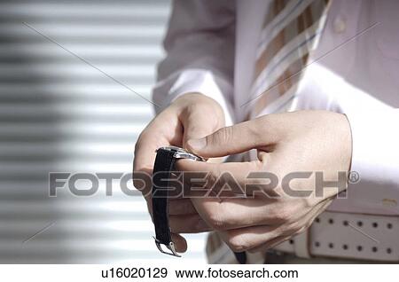 Office worker who attends a watch View Large Photo Image Stock Photo - Office worker who attends a watch. Fotosearch