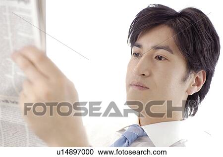 Office worker who reads a newspaper View Large Photo Image Stock Image - Office worker who reads a newspaper. Fotosearch