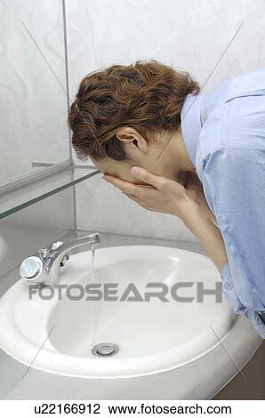 Office worker who washes a face View Large Photo Image Stock Image - Office worker who washes a face. Fotosearch