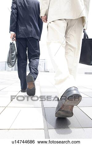 Back figure of the businessmen View Large Photo Image Stock Photograph - Back figure of the businessmen. Fotosearch