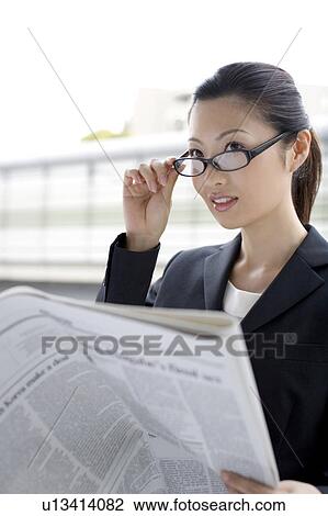 Business lady who reads a newspaper View Large Photo Image Stock Image - Business lady who reads a newspaper. Fotosearch