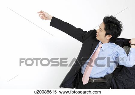 Stock Photography - Businessman putting on the jacket of the suit. Fotosearch