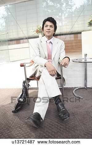 Businessman sitting a chair View Large Photo Image Stock Photo - Businessman sitting a chair. Fotosearch