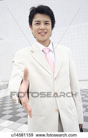 Stock Photo - Businessman trying to shake hands. Fotosearch
