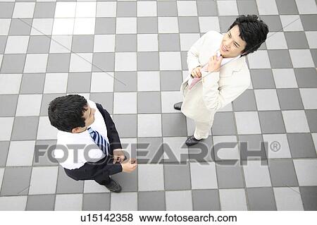 Businessmen before going out View Large Photo Image Stock Photo - Businessmen before going out. Fotosearch