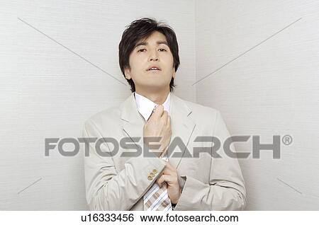 Office worker who shuts a tie View Large Photo Image Stock Photograph - Office worker who shuts a tie. Fotosearch