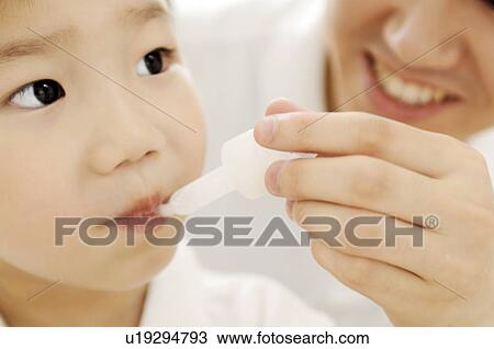 Boy eating a meal View Large Photo Image Stock Image - Boy eating a meal. Fotosearch