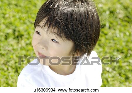 Picture - Boy on the grass. Fotosearch