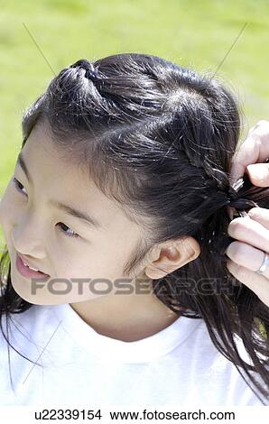Braiding girl View Large Photo Image Picture - Braiding girl. Fotosearch
