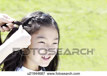 Stock Photo - Braiding girl. Fotosearch