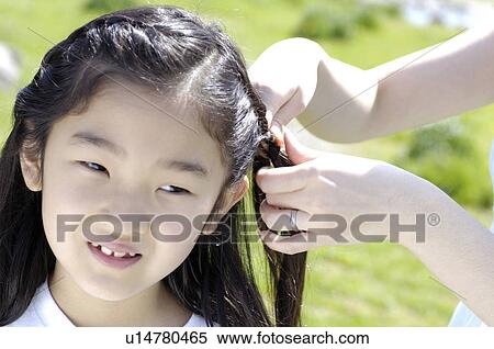 Braiding girl View Large Photo Image Stock Photography - Braiding girl. Fotosearch