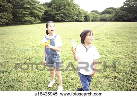 Stock Photography - Brother who plays at the park. Fotosearch
