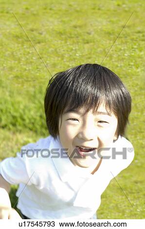 Stock Image - Child on the grassland. Fotosearch