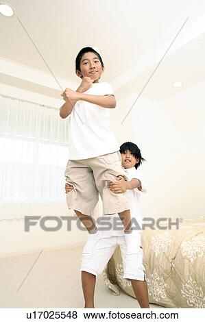 Stock Photo - Children doing group exercises. Fotosearch