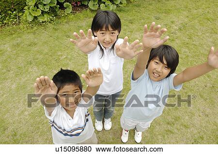 Children who raise both hands View Large Photo Image Stock Image - Children who raise both hands. Fotosearch